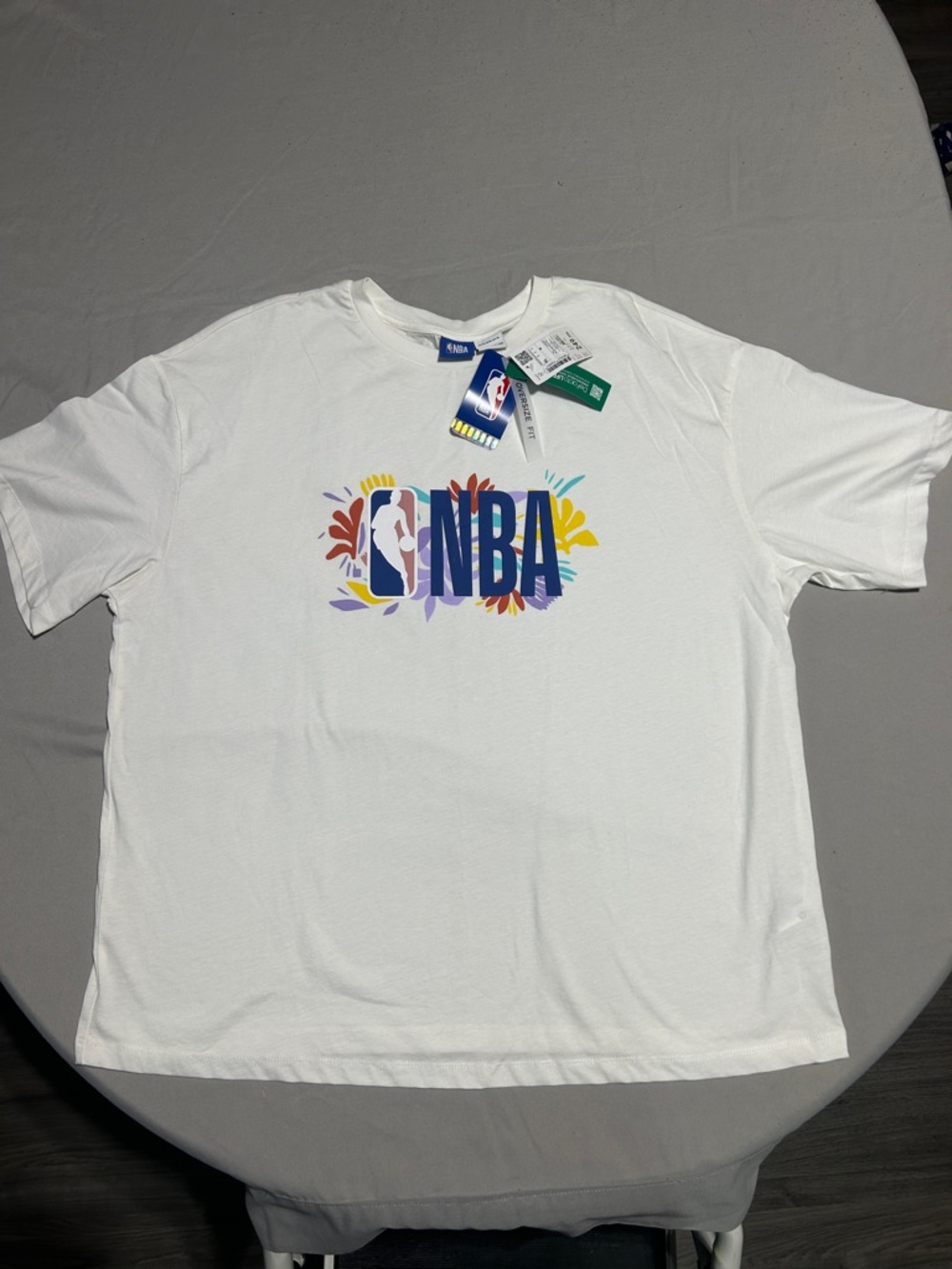 NBA White Tee with Multicolor Floral Logo